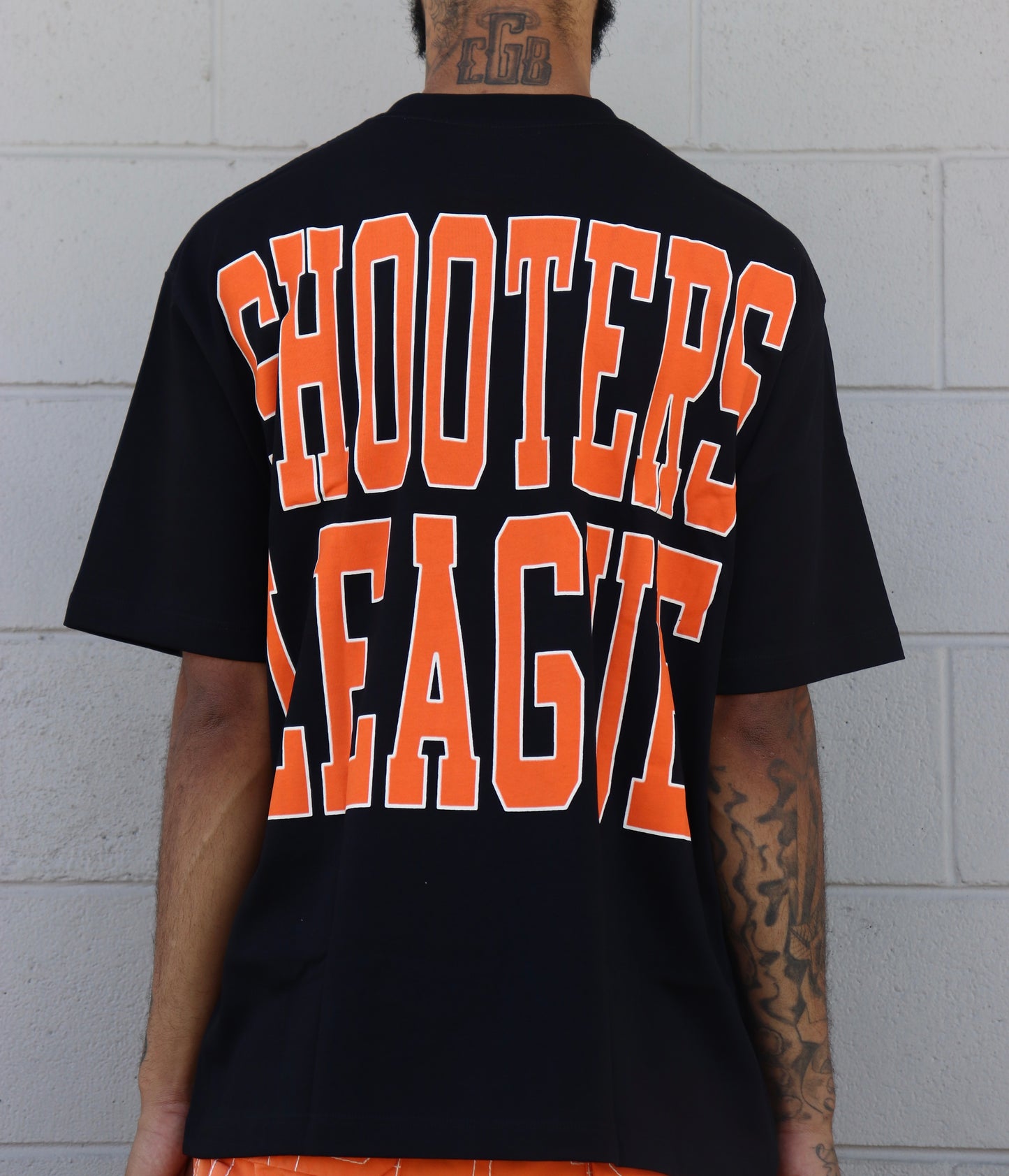 LOVE SUCKS SHOOTERS TEE in BLACK/ORANGE/WHITE