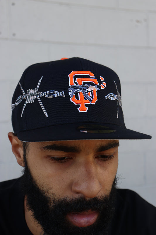 LOVE SUCKS BARBWIRE FITTED CAP in BLACK/ORANGE