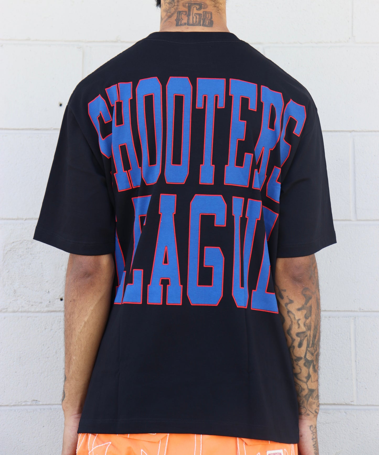 LOVE SUCKS SHOOTERS TEE in BLACK/ROYAL/RED