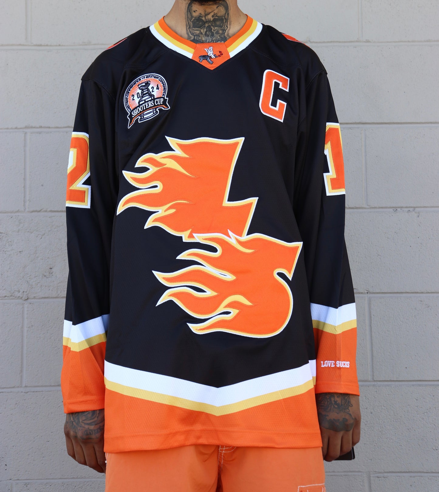 LOVE SUCKS FLAMES HOCKEY JERSEY in BLACK