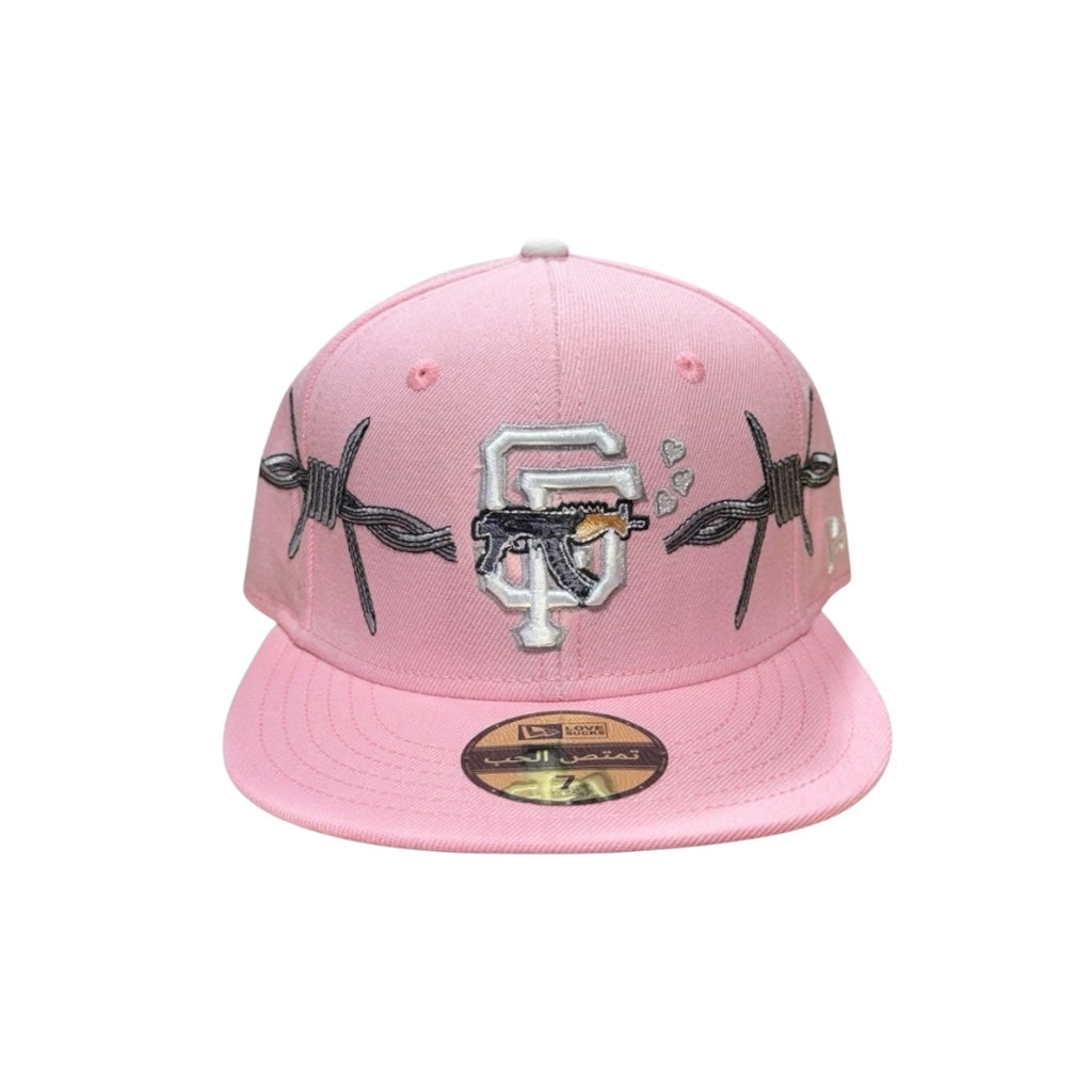LOVE SUCKS BARBWIRE FITTED CAP in Pink