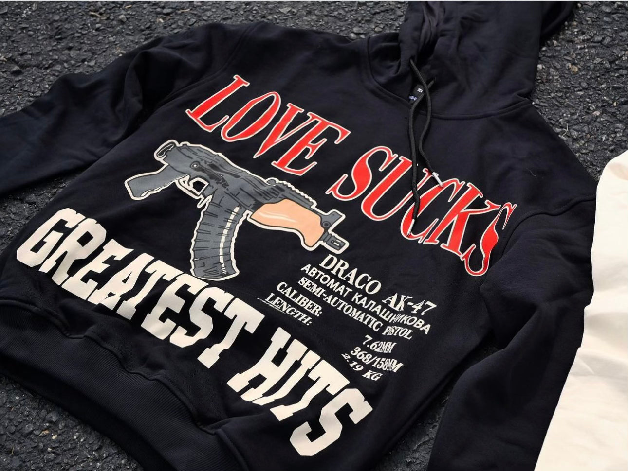 LOVE SUCKS GREATEST HITS HOODIE